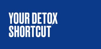 Exercise Daily _ Organic Coconut Activated Charcoal Capsules for Gas and Bloating: Trend or Trap? Fitness focused person holding their stomach after a heavy meal, representing gas and bloating relief goals