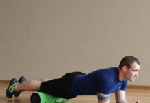Foam rolling exercises for sore legs with an athlete wearing athletic clothing during a recovery workout session.